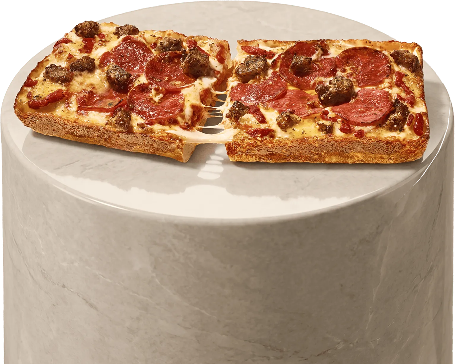 The Domino sits on a marble pedestal: two-piece, Detroit-style, with a Parmesan crust